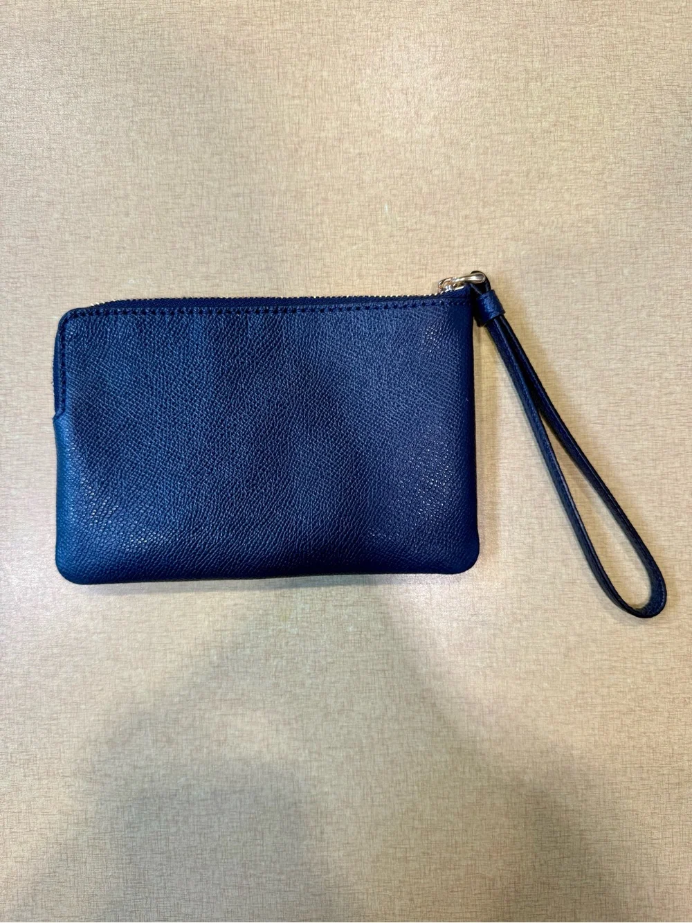 COACH Navy Pebbled Leather Wristlet with Gold Logo
